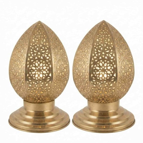 Set of two brass filigree table lamps with hand-pierced geometric patterns on polished round bases