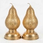 Set of two brass pear table lamps with hand-pierced floral arabesque patterns and curved stem finials