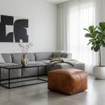Braided leather square pouf in minimalist living room with gray sectional and fiddle leaf fig