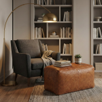 Braided leather ottoman used as footrest and side table in cozy reading nook with armchair