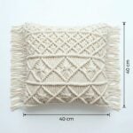 Macrame cushion cover flat lay showing 40cm by 40cm dimensions with hand-knotted geometric cotton pattern and fringe edges