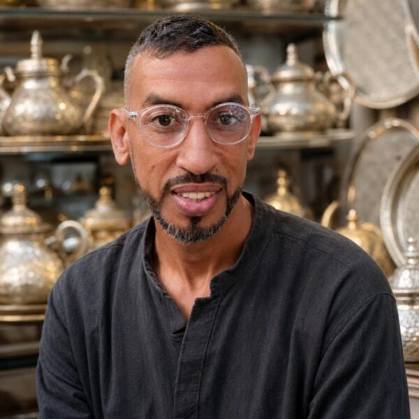 Kamal, a silver-plated metalwork artisan in his Marrakech workshop