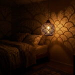 Brass pendant light casting scalloped fish scale shadows across a dark bedroom wall