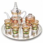 Hand-painted Moroccan glass tea set with teapot, four rosette glasses, sugar bowl and engraved silver tray