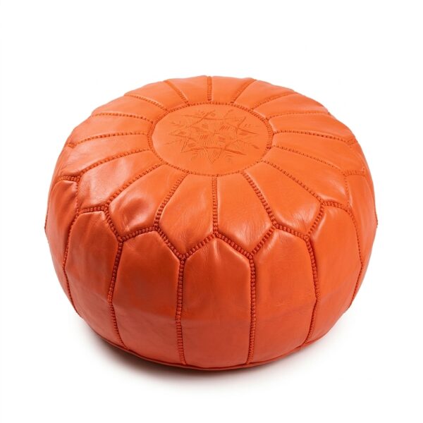 Orange leather pouf, round goatskin ottoman with tonal star embroidery on white background