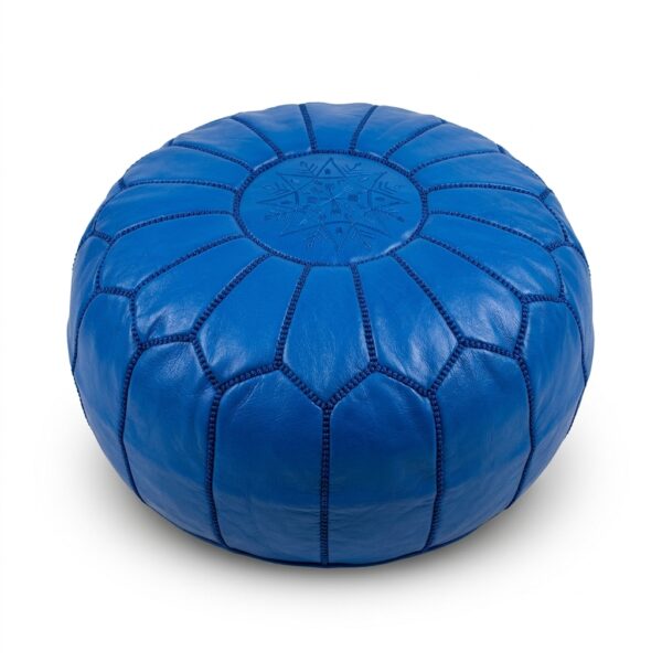 Royal blue leather pouf, round goatskin ottoman with tonal embroidered star on white background
